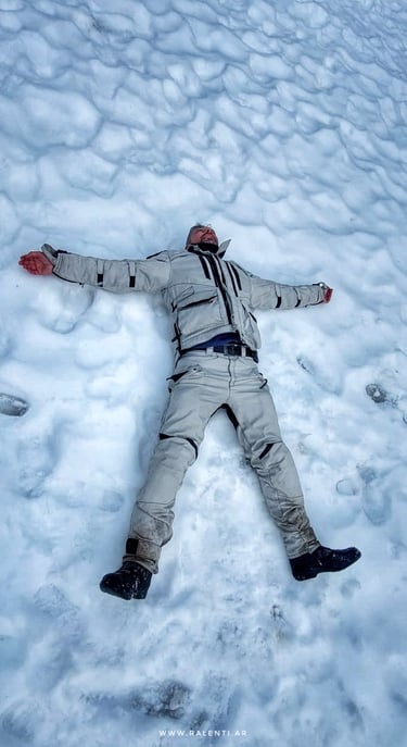a man laying down in the snow